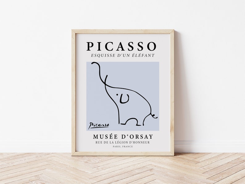 May include: A framed print of a black and white line drawing of an elephant by Pablo Picasso. The print is on a light blue background and includes the text "PICASSO", "ESQUISSE D'UN &Eacute;L&Eacute;FANT", "Picasso", "MUS&Eacute;E D'ORSAY", "RUE DE LA L&Eacute;GION D'HONNEUR", and "PARIS, FRANCE".