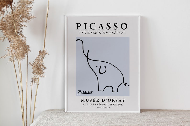 May include: A black and white line drawing of an elephant by Pablo Picasso. The drawing is on a light blue background with the text "PICASSO" and "ESQUISSE D'UN &Eacute;L&Eacute;FANT" in black at the top. The text "MUS&Eacute;E D'ORSAY" is at the bottom of the image, along with the address "RUE DE LA L&Eacute;GION D'HONNEUR" and "PARIS, FRANCE".