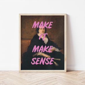 May include: Framed art print featuring a portrait of a woman in a black dress with the text "MAKE IT MAKE SENSE" in bright pink. The artwork has a vintage aesthetic, with a brown background and a light wooden frame.