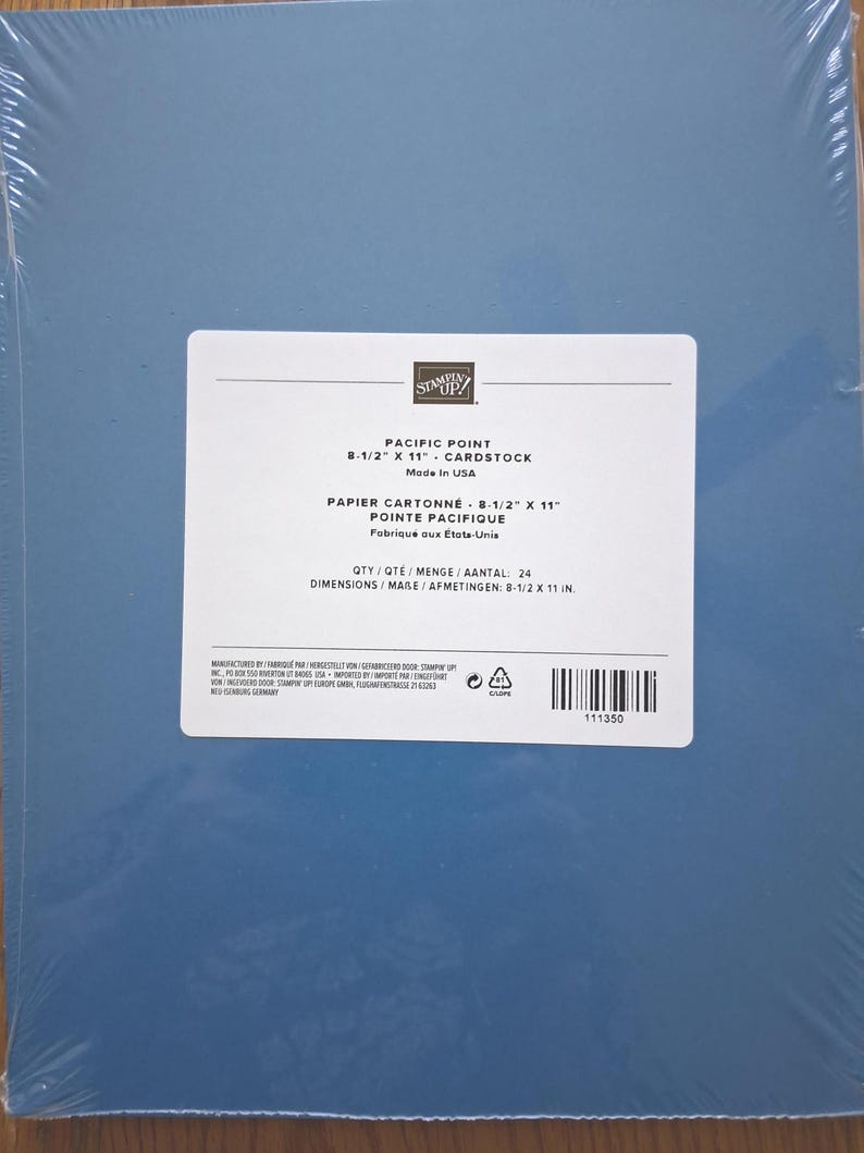 May include: A pack of 24 sheets of Pacific Point blue cardstock, wrapped in clear plastic. The label states the size is 8-1/2 inches by 11 inches, made in the USA, and includes a barcode with the product number 111350 and Stampin' Up branding.