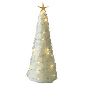 May include: A decorative Christmas tree made of white glass pieces, adorned with warm white lights and a gold starfish topper. The tree has a conical shape and is wrapped with copper wire lights.