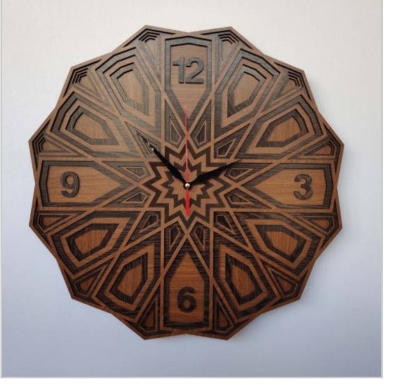 May include: A wooden wall clock with a geometric design. The clock face is brown with black accents and features Roman numerals for the hours. The clock hands are black.