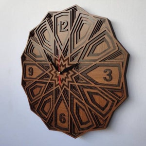 May include: A wooden wall clock with a geometric design. The clock face features Roman numerals and black hands. The clock is made of dark wood with a light wood inlay.