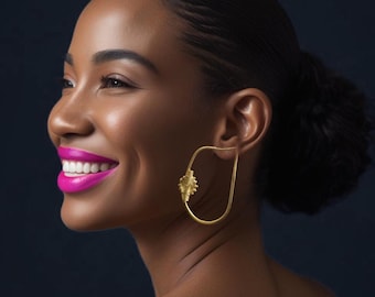 Gilded bronze earrings with Baoulé-NHYIRA weights