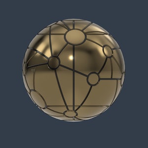 May include: A gold sphere with a black geometric pattern. The sphere has a shiny metallic finish and appears to be made of metal.
