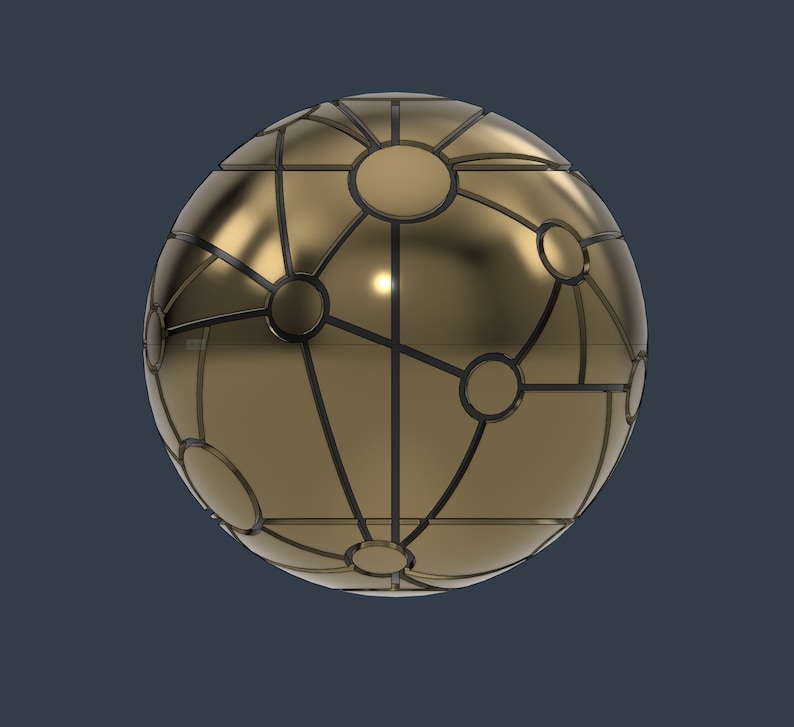 May include: A gold sphere with a black geometric pattern. The sphere has a shiny metallic finish and appears to be made of metal.