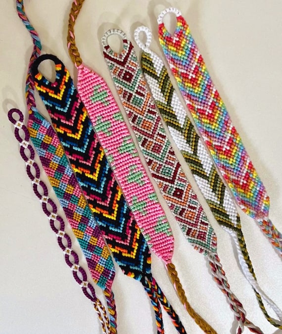 DIY woven friendship bracelets with special braiding. Summer accessories  Stock Photo - Alamy