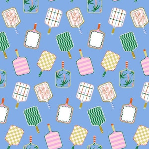 May include: A repeating pattern of pickleball paddles and cutting boards on a light blue background. The paddles and boards feature various designs, including stripes, checks, and tropical motifs. Some paddles have the text "Pickle Society".