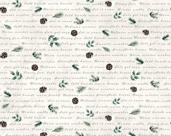 May include: A cream-colored fabric featuring a repeating pattern of brown pinecones, green pine sprigs, and holly leaves. The design includes cursive text phrases such as Let it snow, Warm winter wishes, Frosty fun, and Cold hands warm hearts.