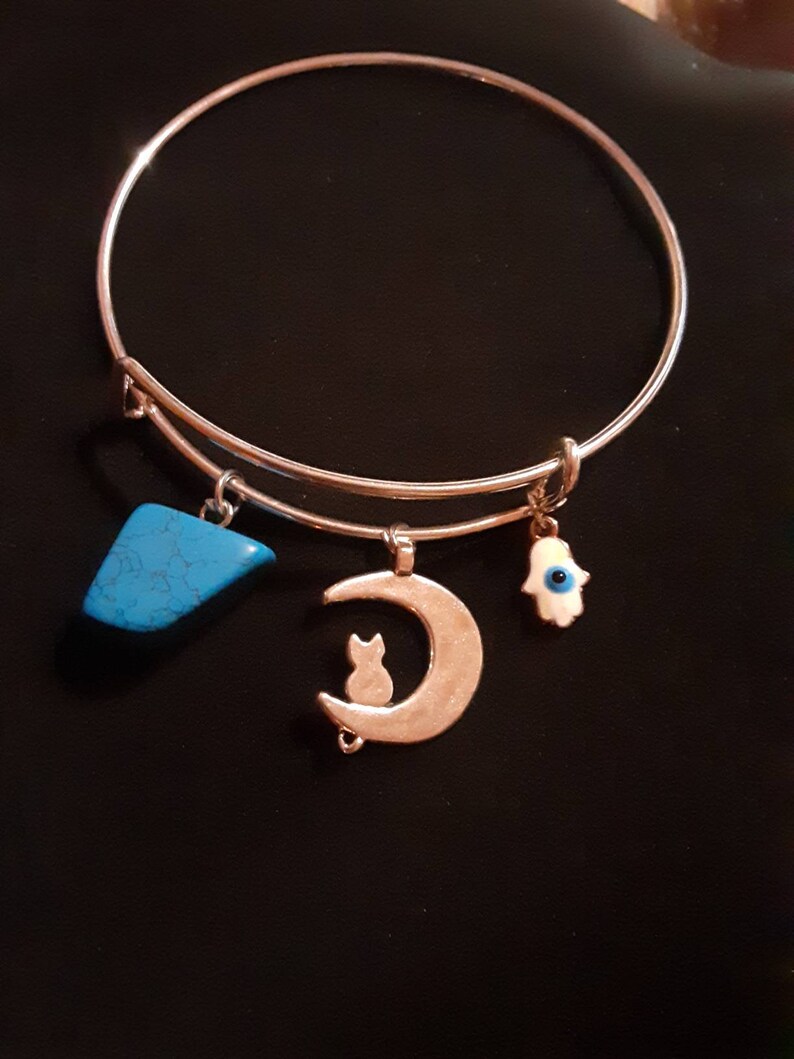 Cuffcharm bracelet stainless steel cat and moon with polished blue howlite and white hasma charm