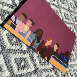 May include: A digital illustration of a group of people sitting on a yellow bench. The people are diverse in skin tone and hair color. The background is a solid purple color.