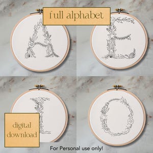May include: Four embroidery hoops with black line drawings of the letters A, E, I, and O. The letters are surrounded by floral designs and sea life, such as starfish, seashells, and seaweed. The text "full alphabet" and "digital download" are visible in the image.