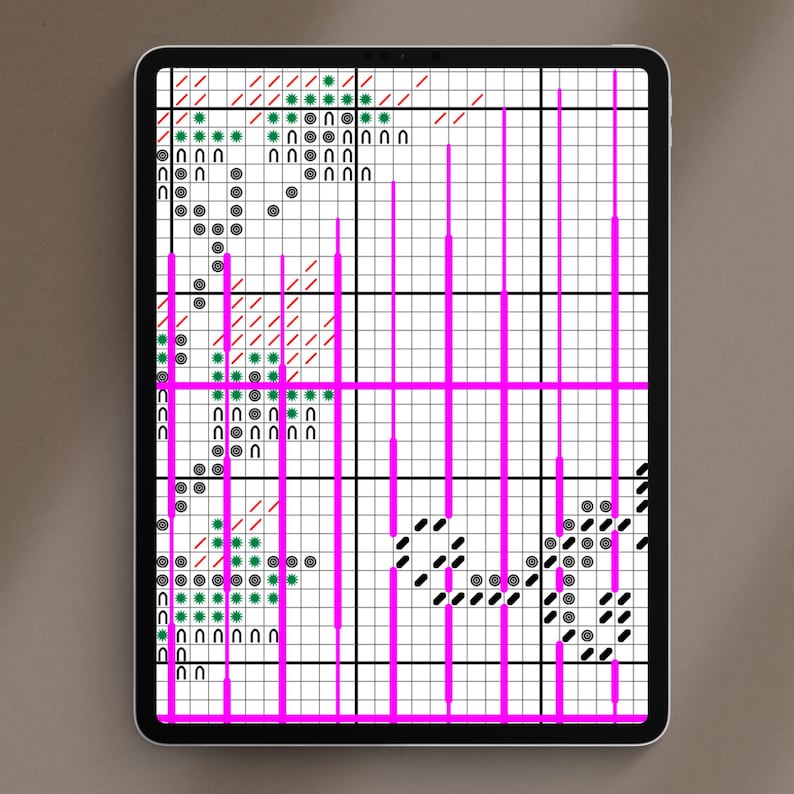 May include: A digital cross-stitch pattern displayed on a tablet. The design features a grid with various symbols in black, green, and red, accented by bright pink vertical and horizontal lines. The tablet is set against a neutral background.