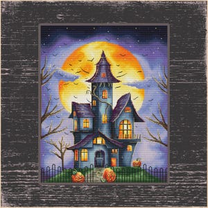 May include: A cross-stitch design of a spooky haunted house with a large orange moon in the background. The house is blue with orange lit windows, and two carved pumpkins sit in front. Bare trees and flying bats complete the Halloween scene.