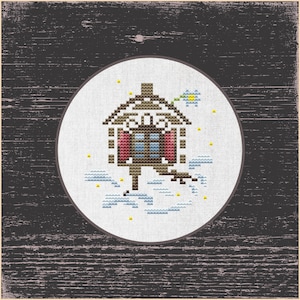 May include: A cross-stitch design featuring a small brown house with red windows and a blue flower on a white background. The house is surrounded by small blue and yellow clouds.