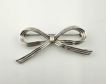 Vintage Crown Trifari Bow Brooch Silver Tone Ribbon Pin Minimalist Jewelry 1960s Classic Designer Signed Brooch