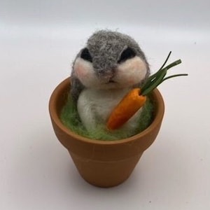 Adorable needle felted bunny rabbit, sitting in a terra cotta clay pot,moss,holding carrot,Easter,summer,spring,floppy ears,chubby cheeks