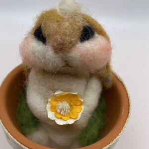 Needle felted bunny rabbit holding flowers, clay pot,daisy ribbon,floppy ears,Easterbasket,springtime,homemade,smiling,chubby cheeks,lop