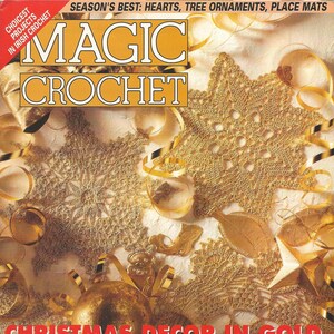 May include: A magazine cover for Magic Crochet magazine, featuring a gold, white, and red Christmas decor theme. The cover features crocheted snowflakes, ornaments, and placemats. The text on the cover reads "Christmas Decor in Gold, White or Red and Green".