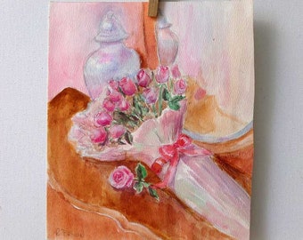 May include: A watercolor painting of a bouquet of pink roses wrapped in white paper with a red ribbon. The roses are on a table with a white vase and a mirror in the background.