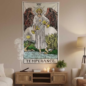 May include: A rectangular wall tapestry featuring the Temperance tarot card. The artwork depicts an angel holding two chalices, standing near water. The tapestry has a cream background with black text that reads "TEMPERANCE."