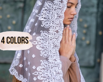 May include: A white lace veil featuring detailed floral designs. The veil is worn over the head and shoulders. The image includes the text "4 COLORS".