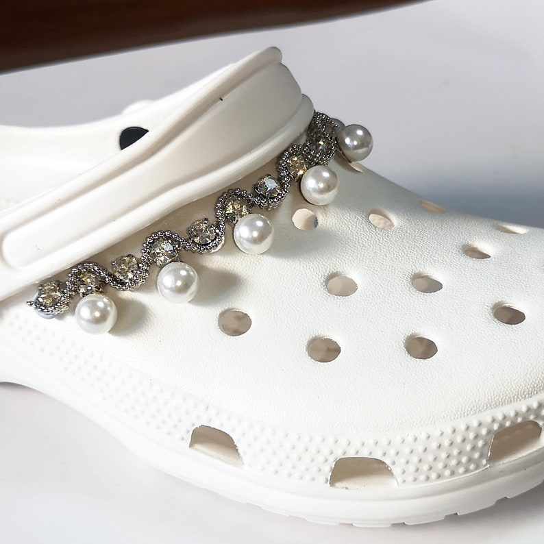 what stores sell charms for crocs