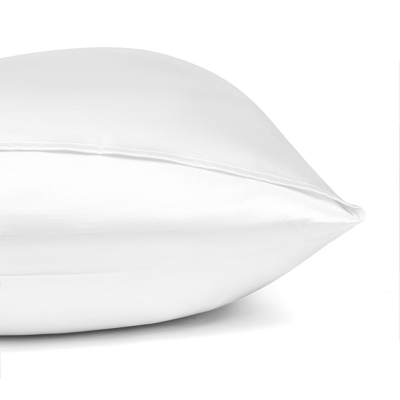 May include: A white pillowcase made of satin.