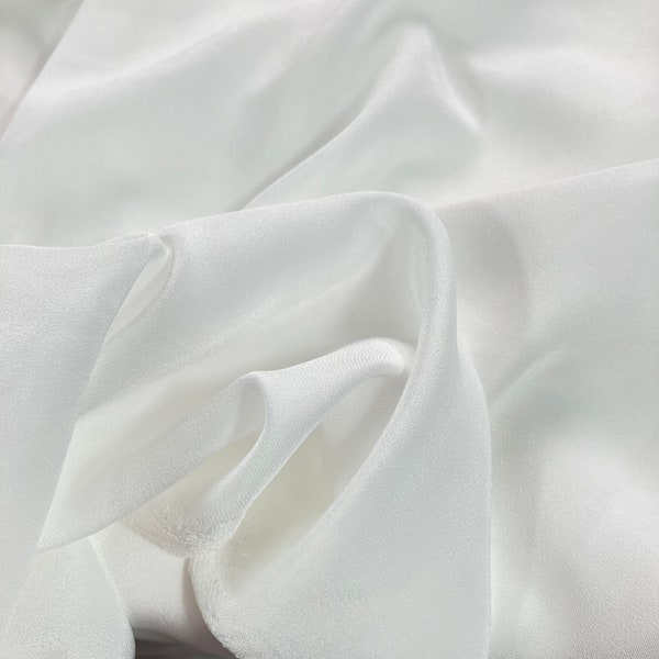 Polyester crepe fabric / Super soft hand feel / Natural white, unprocessed / 68.5 gsm fabric weight / 150cm fabric width / Sell by the meter