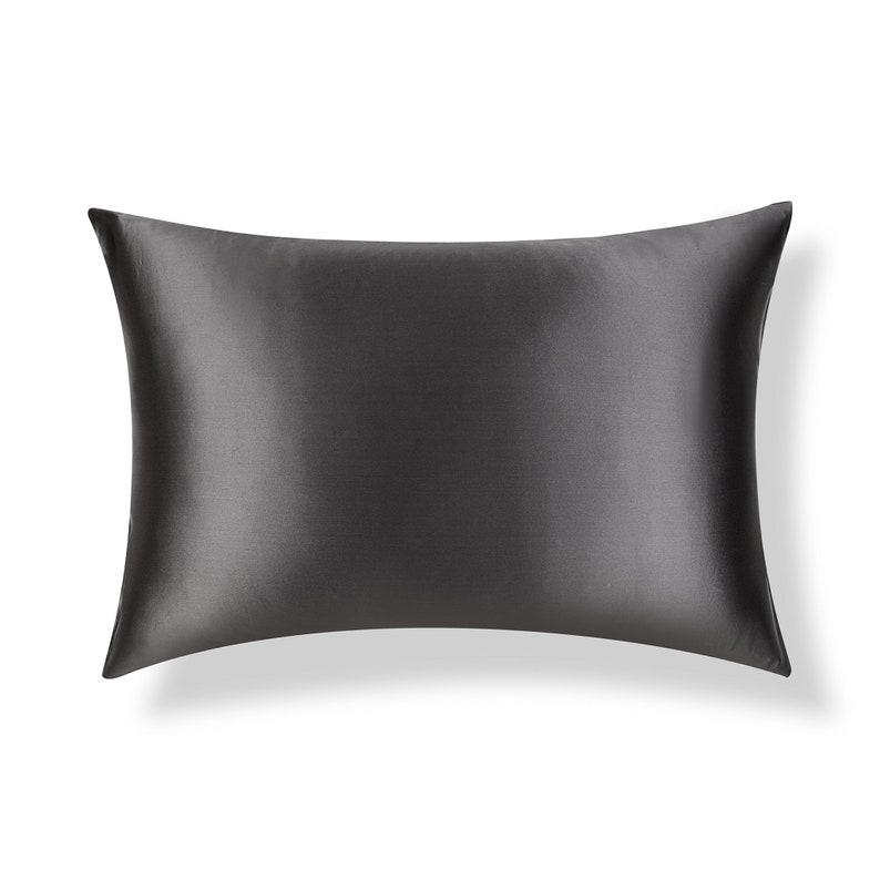 May include: A black satin pillowcase. The pillowcase is smooth and wrinkle-free.