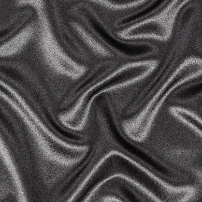 May include: A smooth, silky fabric in a deep charcoal gray color. The fabric is draped and folded, creating soft, flowing lines and curves.