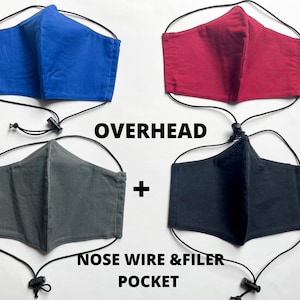 May include: Four face masks with adjustable ear loops and nose wire. Two masks are dark gray, one is black, one is red, and one is blue. The text "OVERHEAD + NOSE WIRE & FILTER POCKET" is printed below the masks.