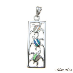 May include: Sterling silver pendant featuring three sea turtles with iridescent opal inlay. The turtles are arranged vertically within a rectangular frame.