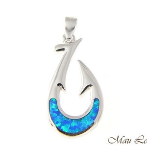 May include: A silver fishing hook pendant with a blue opal inlay. The hook is a traditional Hawaiian design.