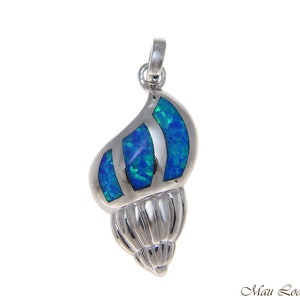 May include: A silver pendant featuring a blue opal seashell design. The seashell is detailed with a textured surface and a silver bail.