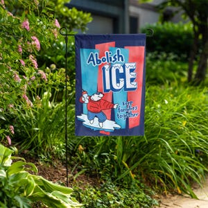 May include: A navy blue garden flag with the words "Abolish ICE" in light blue and white, with a cartoon polar bear holding a bottle. The flag also says "keep families together" in white.