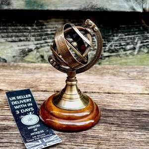 Vintage Armillary Sphere on Elegant Wooden Base: A Nostalgic Decor Accent for Your Home Décor Antique-Inspired Armillary Sphere