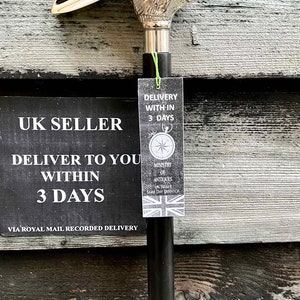 May include: A silver rabbit head walking stick with a black shaft. The stick has a tag attached that says "Delivery within 3 days" and "Ministry of Antiques UK Seller Same Day Dispatch".