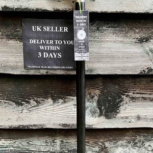 May include: A black walking stick with a silver rabbit head handle. The stick has a tag attached that says "UK Seller Deliver to you within 3 days via Royal Mail Recorded Delivery".