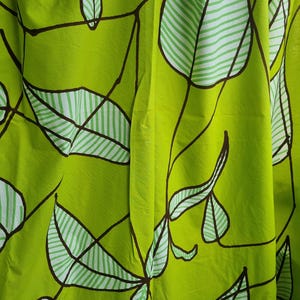Marimekko Sarastaa Green Fabric cotton fabric, designed by Erja Hirvi