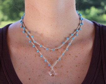 layered beaded crochet necklace with light blue beads