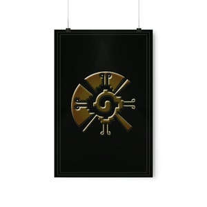 May include: A gold-colored Aztec calendar symbol on a black background. The symbol is a circle with four points, each with a smaller circle at the end. The center of the circle has a spiral design.