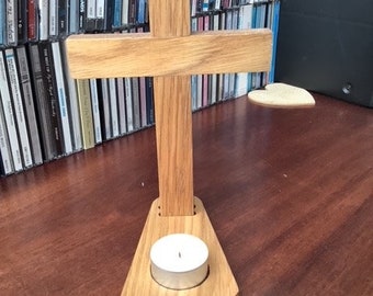 Christian cross with candle holder base