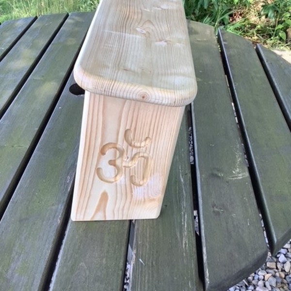 Folding meditation/prayer stool with Om symbol carving on both legs