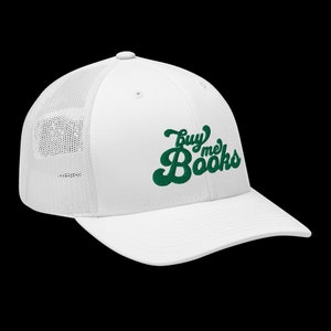 May include: White trucker hat with a green embroidered logo that says "Buy me Books" in a retro font.