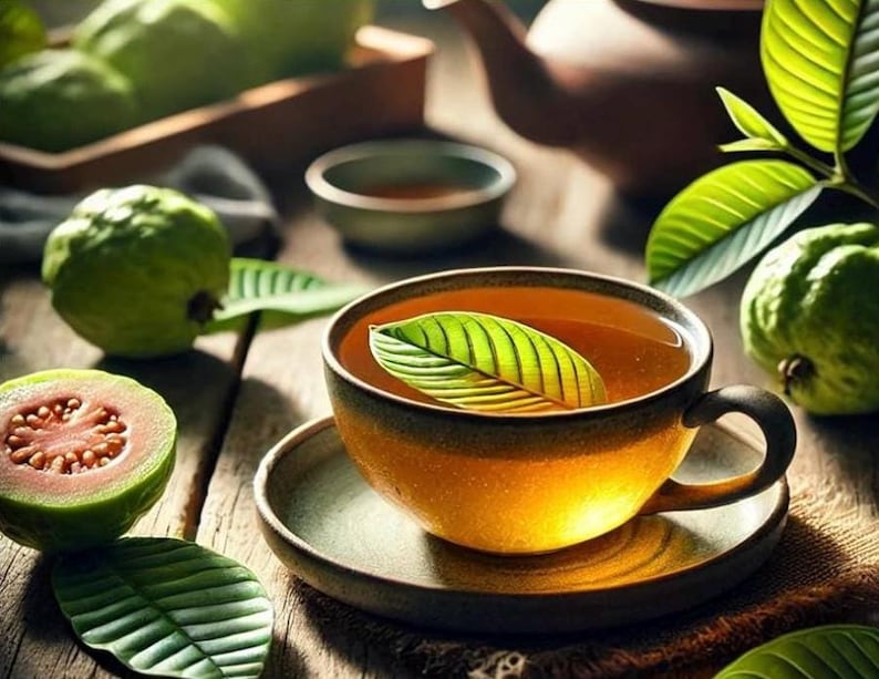 May include: A cup of tea with a green leaf floating on top, set on a saucer. The cup is yellow and brown, and the tea is amber-colored. Guava fruit and leaves are scattered around the cup on a wooden surface, with a teapot in the background.