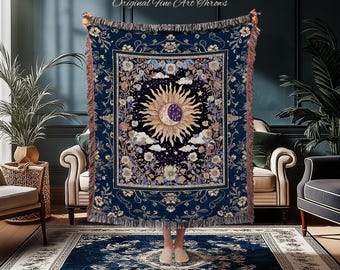 May include: A navy blue throw blanket with a celestial design featuring a sun, moon, stars, and floral border. The blanket has a fringed edge and the text "JOY OF PLANTS Original Fine Art Throws".