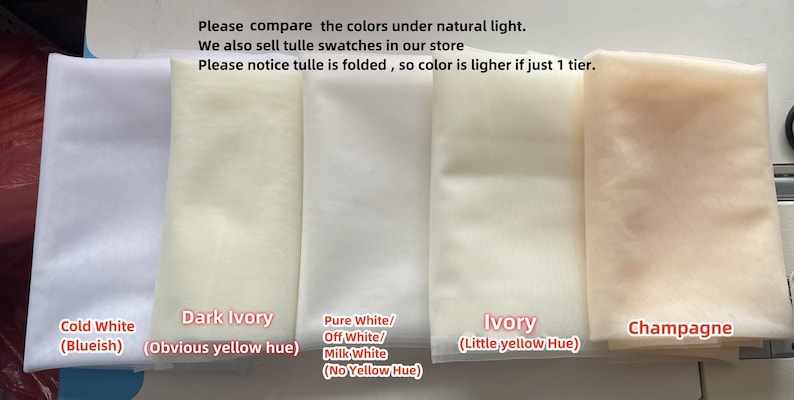 May include: Five swatches of tulle fabric in different shades of white and ivory. The swatches are labelled "Cold White (Blueish)", "Dark Ivory (Obvious yellow hue)", "Pure White/Off White/Milk White (No Yellow Hue)", "Ivory (Little yellow Hue)", and "Champagne".