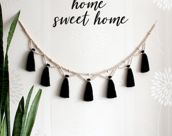 Black tassel garland for mantel. Witchy bedroom wall decor over the bed. Halloween garland. Boho yarn wall hanging. Hippie window bunting