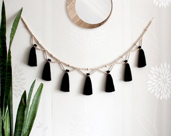 Black tassel garland for mantel. Witchy wall decor over the bed. Boho wood bead yarn wall hanging. Hippie window bunting. Halloween garland